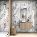 Marble Waves glossy marble effect porcelain tile 60x120cm with flowing grey and gold veining in a modern luxury bathroom.