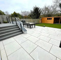 Alpine white veined outdoor porcelain paving tiles 900x600mm on bright patio