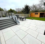 Alpine white veined outdoor porcelain paving tiles 900x600mm on bright patio