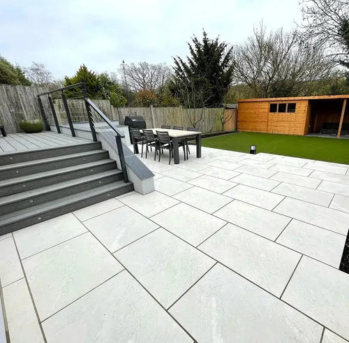 Alpine white veined outdoor porcelain paving tiles 900x600mm on bright patio