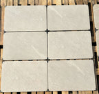 Mountain white outdoor porcelain paving slabs 900x600mm in landscaped garden