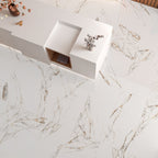 Top-down view of Ayora White Polished porcelain tiles laid on the floor with matching cladded walls, showcasing their glossy marble-effect finish.