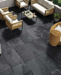 Deep Brazilian black outdoor porcelain paving tiles 900x600mm on dramatic patio