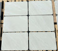 Bright white outdoor porcelain paving tiles 900x600mm on contemporary patio