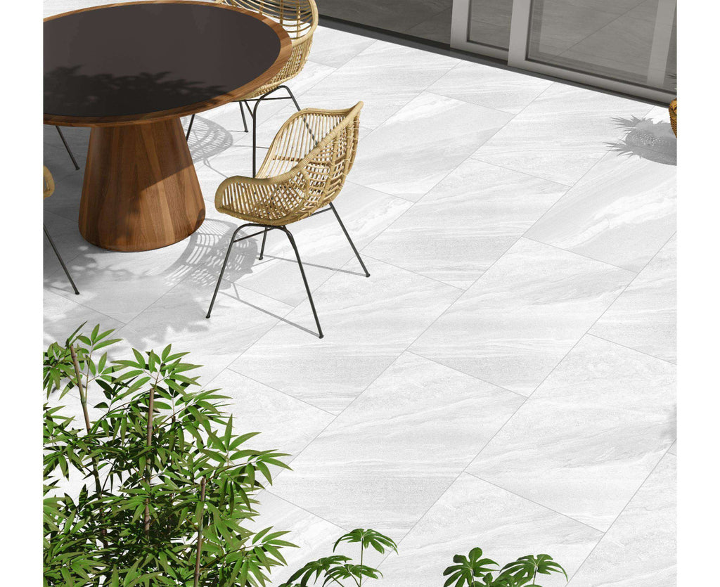 White porcelain paving slabs 900x600mm laid in garden setting
