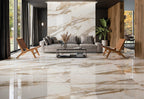 Calcatta Gold Polished Wall & Floor Tile 60x120cm used in luxury living room interior with feature wall and reflective marble-style flooring.
