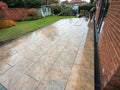 Rustic copper slate effect outdoor porcelain paving tiles 900x600mm on garden terrace