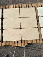 Heritage cream veined outdoor porcelain paving tiles 900x600mm laid on a UK garden patio