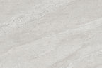 Neutral light grey porcelain paving tile showing directional movement 900x600mm