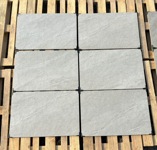 Coastal light grey outdoor porcelain paving tiles 900x600mm laid on a UK garden patio