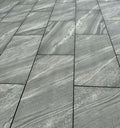 Modern crossover grey outdoor porcelain paving tiles 900x600mm on contemporary terrace