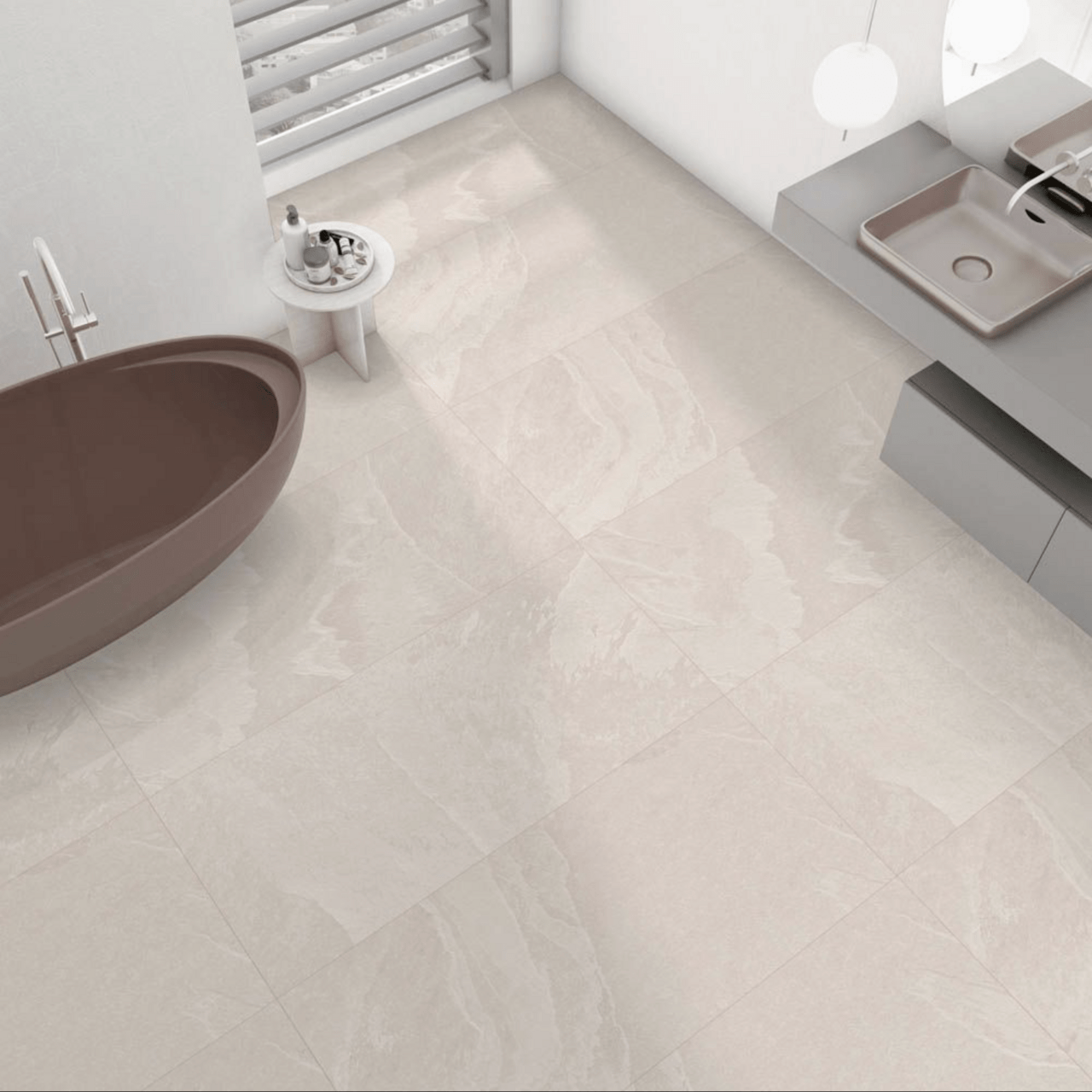 Modern bathroom with Dune Cream Stone Effect Tiles used across floor and wall, styled with a freestanding tub and wall-hung vanity.