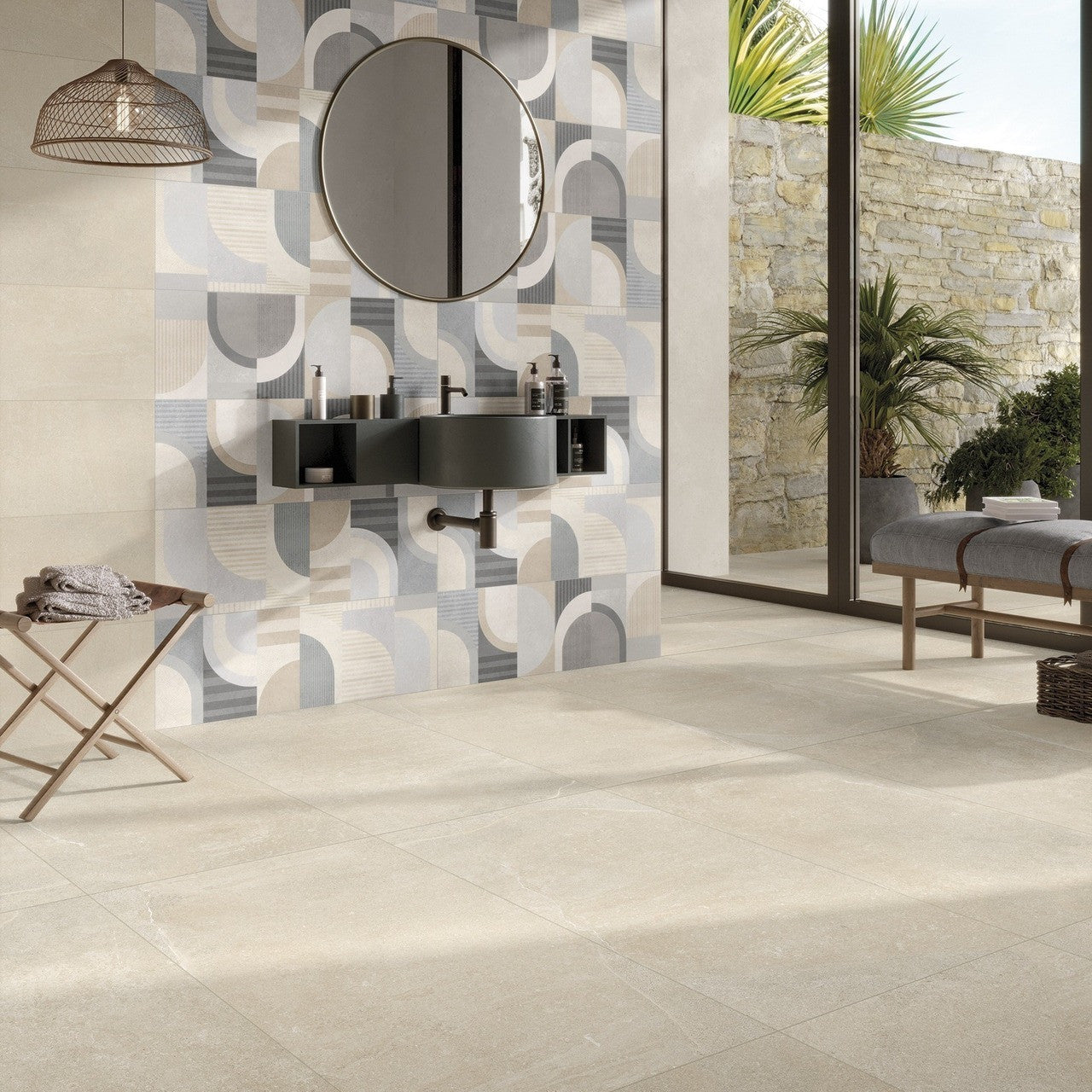 Modern bathroom interior with Earth Beige stone-effect porcelain tile used on floors and feature wall with geometric patterned accent tiles.