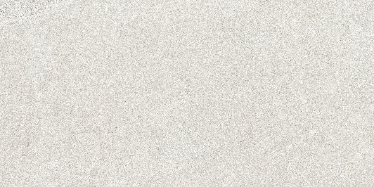 Flat lay of Earth White Tile showing its limestone-inspired texture and soft veining