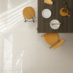Elegant dining space featuring Eden Ivory Marble Gloss Tiles with a soft polished finish under natural light.