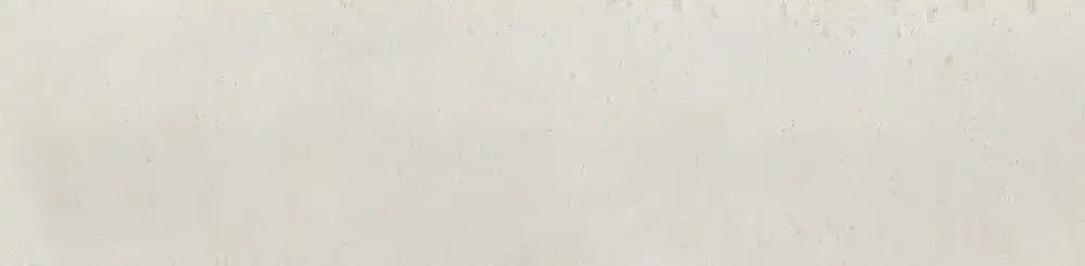 Close-up of Edgy White Glossy Metro Tile displaying natural white glaze, handcrafted surface texture and subtle beige undertones.