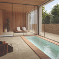 Eterna Beige porcelain tile used in a modern spa space with indoor pool and loungers.