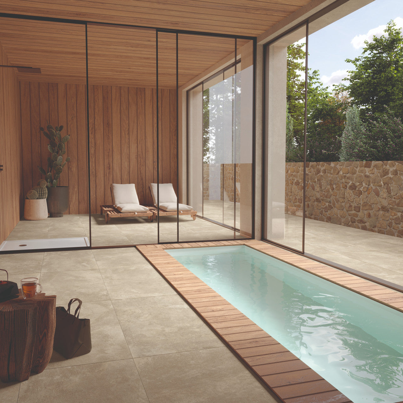 Eterna Beige porcelain tile used in a modern spa space with indoor pool and loungers.