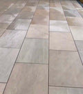 Bold forest green outdoor porcelain paving tiles 900x600mm on garden patio