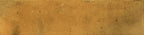Textured surface of Urban Yellow Glossy Metro Wall Tile with rich golden hues and natural variation under a smooth glazed finish.
