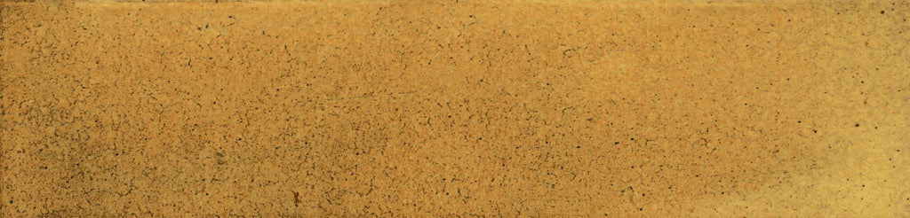 Detailed close-up of Urban Yellow Glossy Metro Tile showing honey-yellow tones, handcrafted texture and light surface speckling.