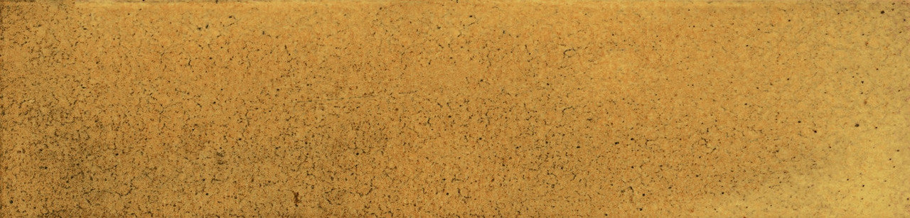 Detailed close-up of Urban Yellow Glossy Metro Tile showing honey-yellow tones, handcrafted texture and light surface speckling.