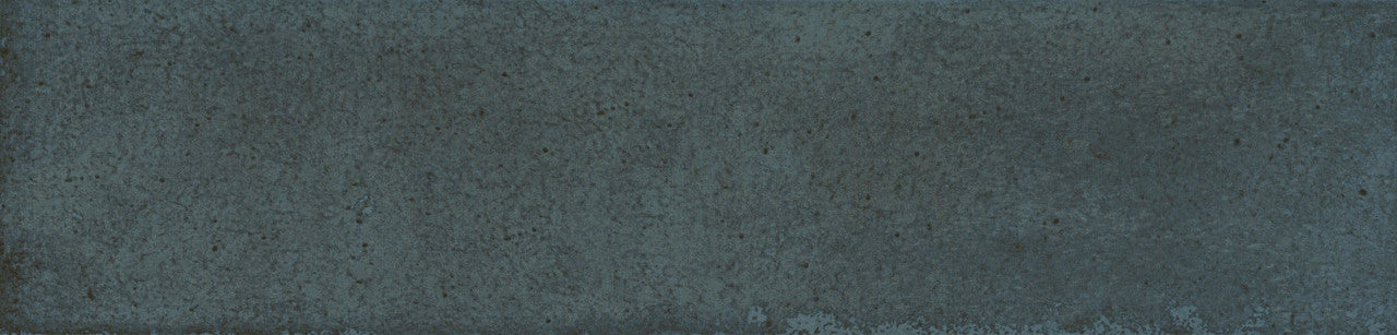Detailed tile image of Urban Blue Glossy Metro Wall Tile with handcrafted finish and tonal variation in dark blue.