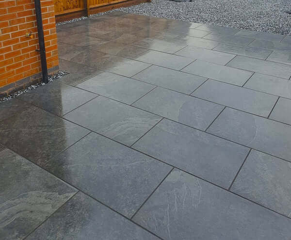 Black stone effect porcelain paving slab close-up 900x600mm