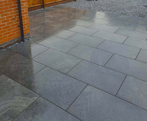 Black stone effect porcelain paving slab close-up 900x600mm