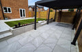 Textured lava grey outdoor porcelain paving tiles 900x600mm on garden patio