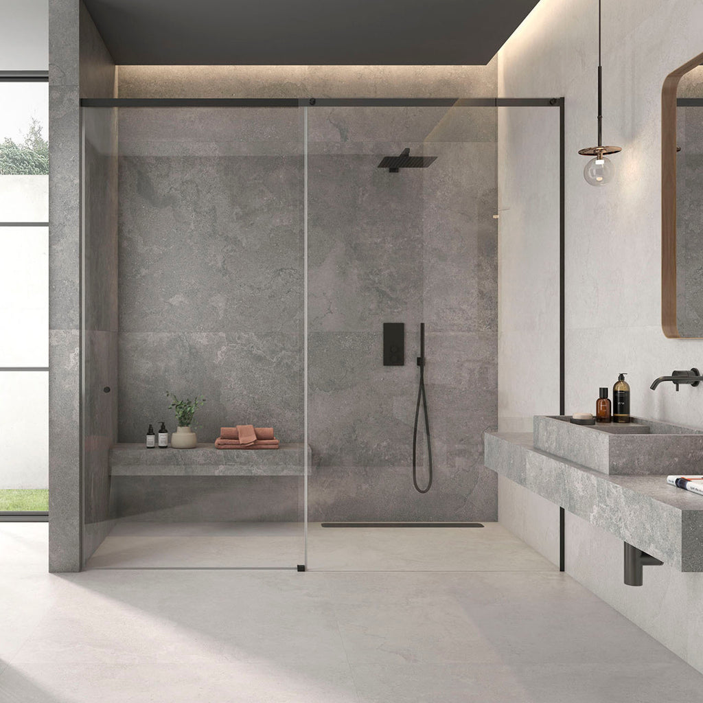 Modern bathroom setting featuring Leto Grey Stone-effect Wall & Floor Tiles with walk-in shower and floating basin.