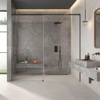 Modern bathroom setting featuring Leto Grey Stone-effect Wall & Floor Tiles with walk-in shower and floating basin.