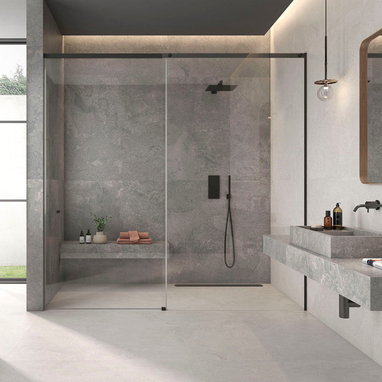 Modern bathroom setting featuring Leto Grey Stone-effect Wall & Floor Tiles with walk-in shower and floating basin.
