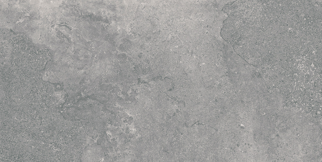 Close-up texture of the Leto Grey porcelain tile showing its natural stone-inspired matte surface and grey tonal variations.