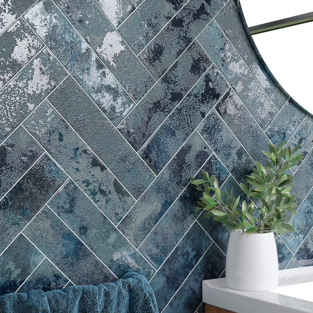 Close-up of Oceania Blue Textured Metro Wall Tile 6cm x 25cm showing glossy textured finish and herringbone pattern