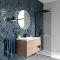 Oceania Blue Textured Metro Wall Tile 6cm x 25cm used on bathroom feature wall with modern vanity and glass shower