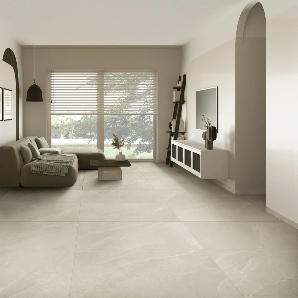 Modern living room with Pietra Ivory stone-effect floor tiles and neutral décor