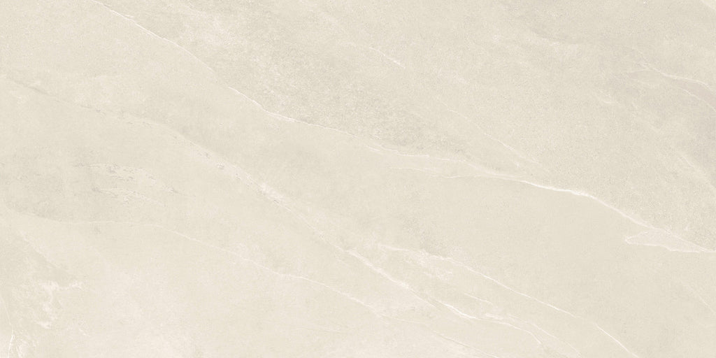 Close-up of Pietra Ivory porcelain tile showing natural stone-like texture and warm Ivory tones