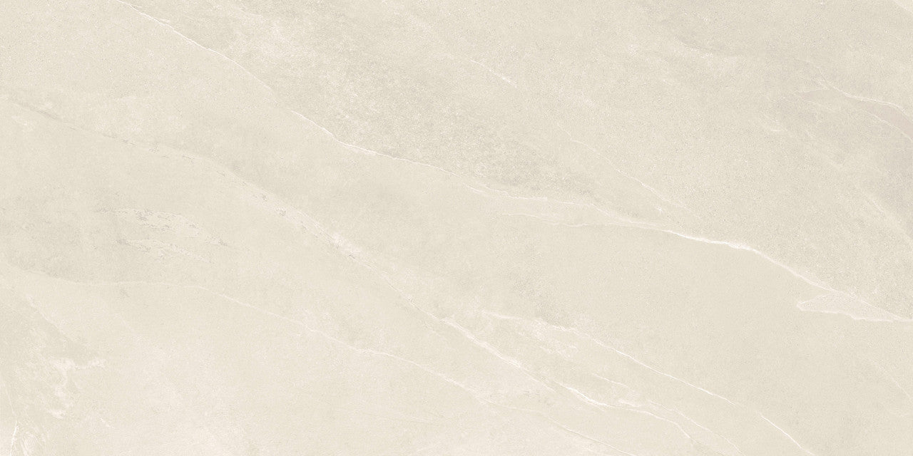 Close-up of Pietra Ivory porcelain tile showing natural stone-like texture and warm Ivory tones