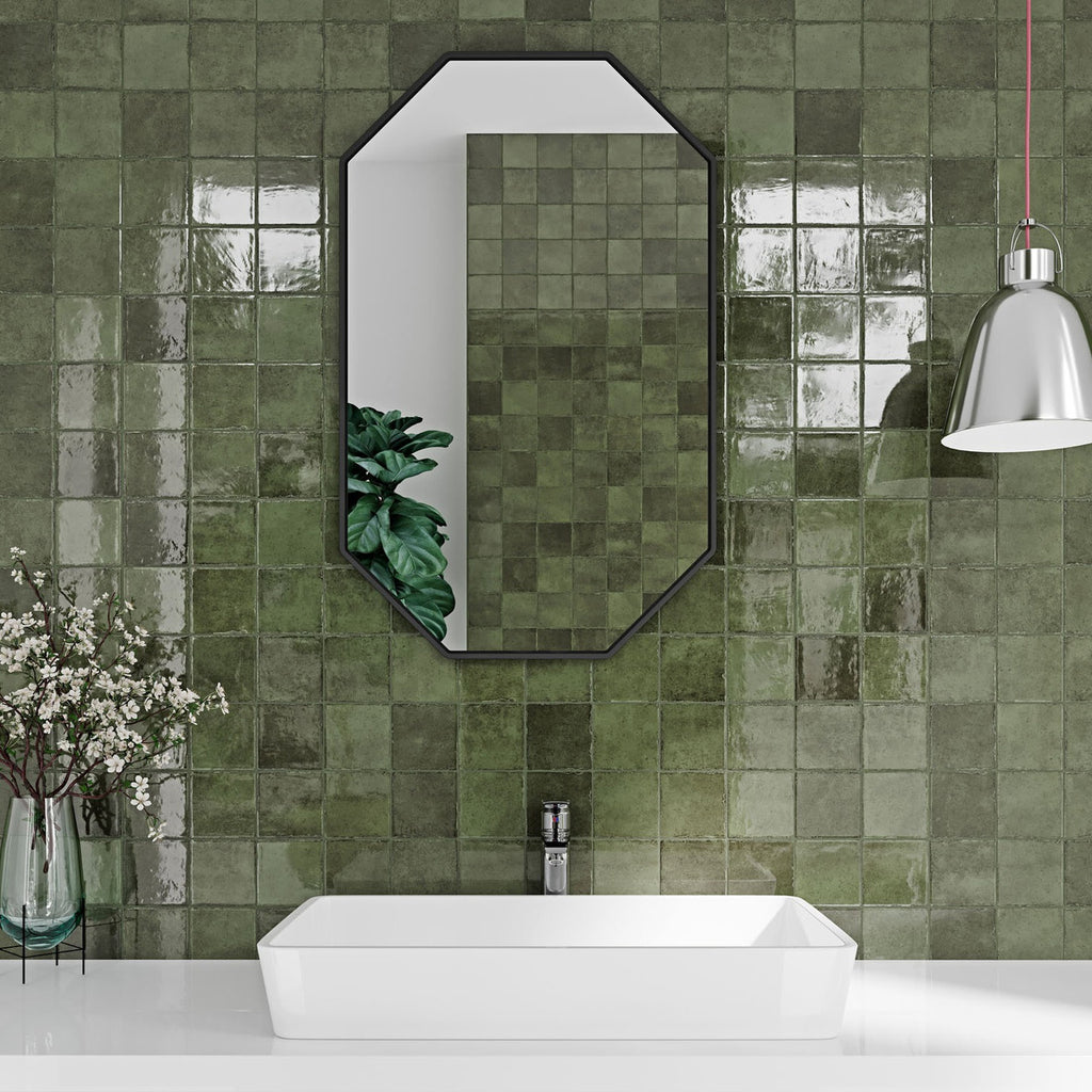 Modern bathroom interior featuring Pixel Green Glossy Square Wall Tiles in a lush sage tone, used as a striking feature wall behind a white basin and mirror.