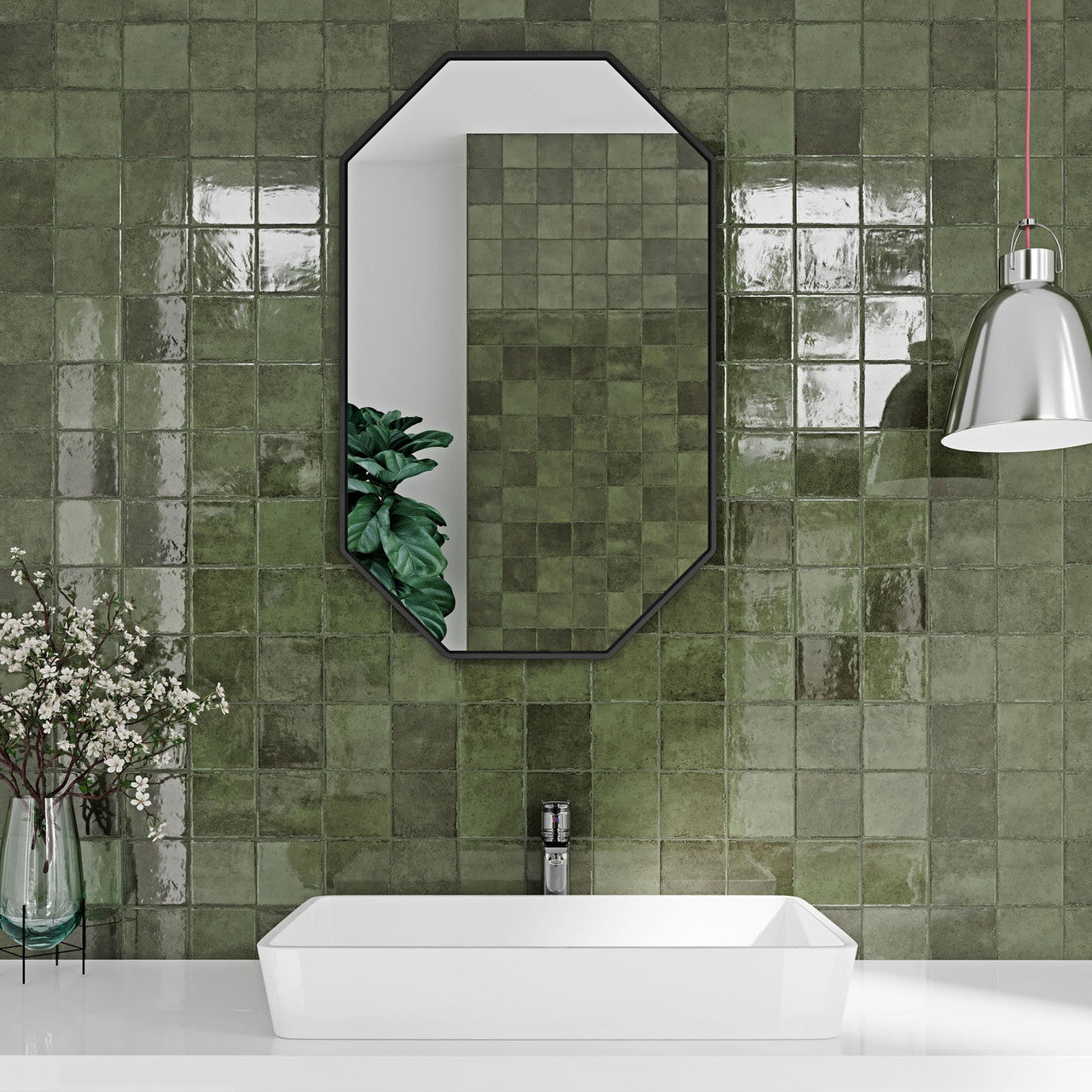 Modern bathroom interior featuring Pixel Green Glossy Square Wall Tiles in a lush sage tone, used as a striking feature wall behind a white basin and mirror.