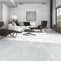 Contemporary living room featuring Quarry White stone-effect tiles on both floor and wall, paired with minimalist furniture.