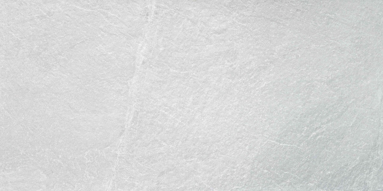 Detailed close-up of Quarry White tile surface showing soft white texture and stone-like detailing.