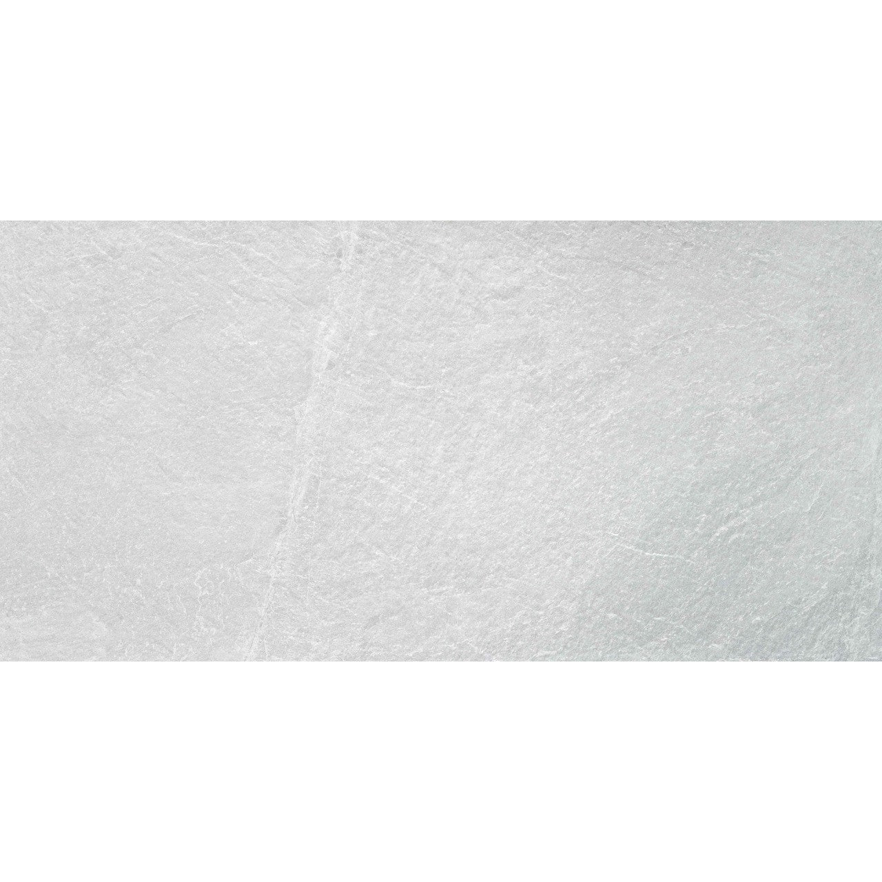 Detailed close-up of Quarry White tile surface showing soft white texture and stone-like detailing.