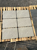Silver quartz grey outdoor porcelain paving tiles 900x600mm laid on a modern UK patio