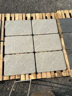 Silver quartz grey outdoor porcelain paving tiles 900x600mm laid on a modern UK patio