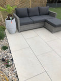 Clean quartz white outdoor porcelain paving tiles 900x600mm on contemporary patio