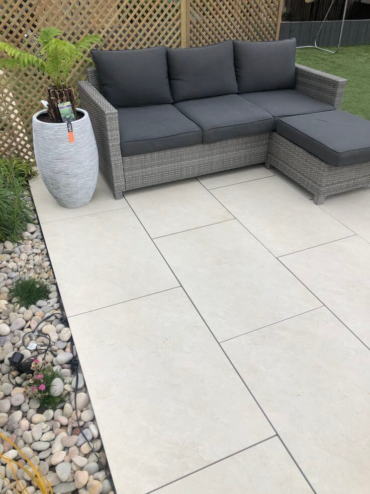 Clean quartz white outdoor porcelain paving tiles 900x600mm on contemporary patio
