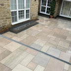 Earthy green stone effect outdoor porcelain paving tiles 900x600mm on garden patio