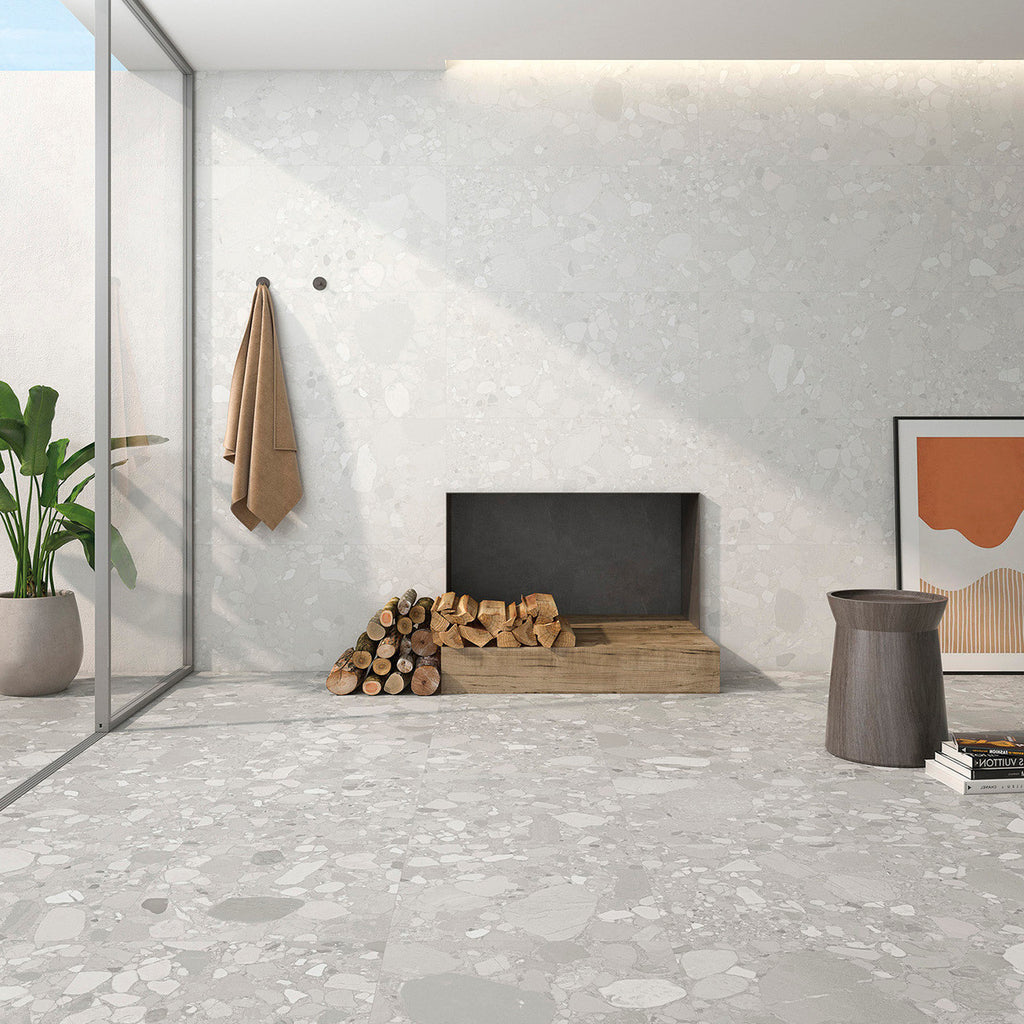 Modern living space featuring Roca White Terrazzo Matt Tile on floor and walls with wood accents and natural lighting.